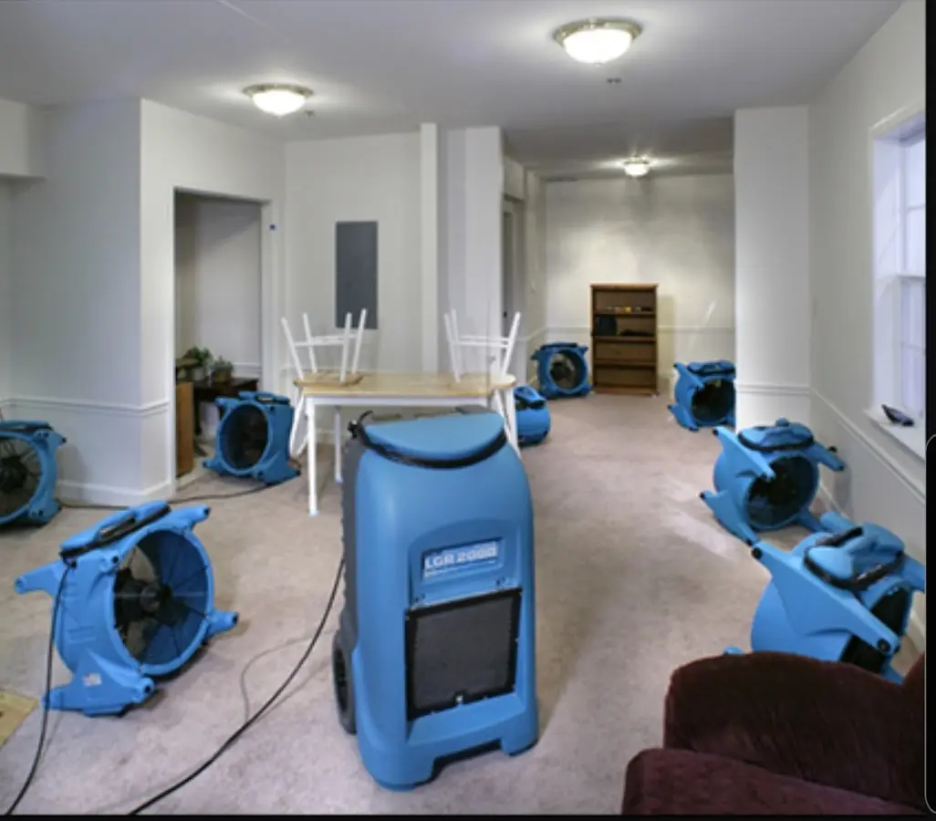 Air movers and dehumidifier setup for Water Damage Restoration in Douglas
